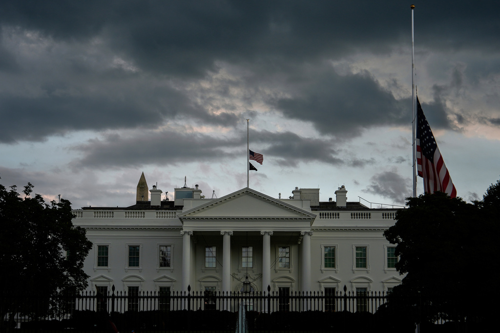 American flags at the White House fly at half-staff after the death of Charlie Kirk, the CEO and co-founder of Turning Point USA, Thursday, Sept. 11, 2025, in Washington. (AP Photo/Julia Demaree Nikhinson)