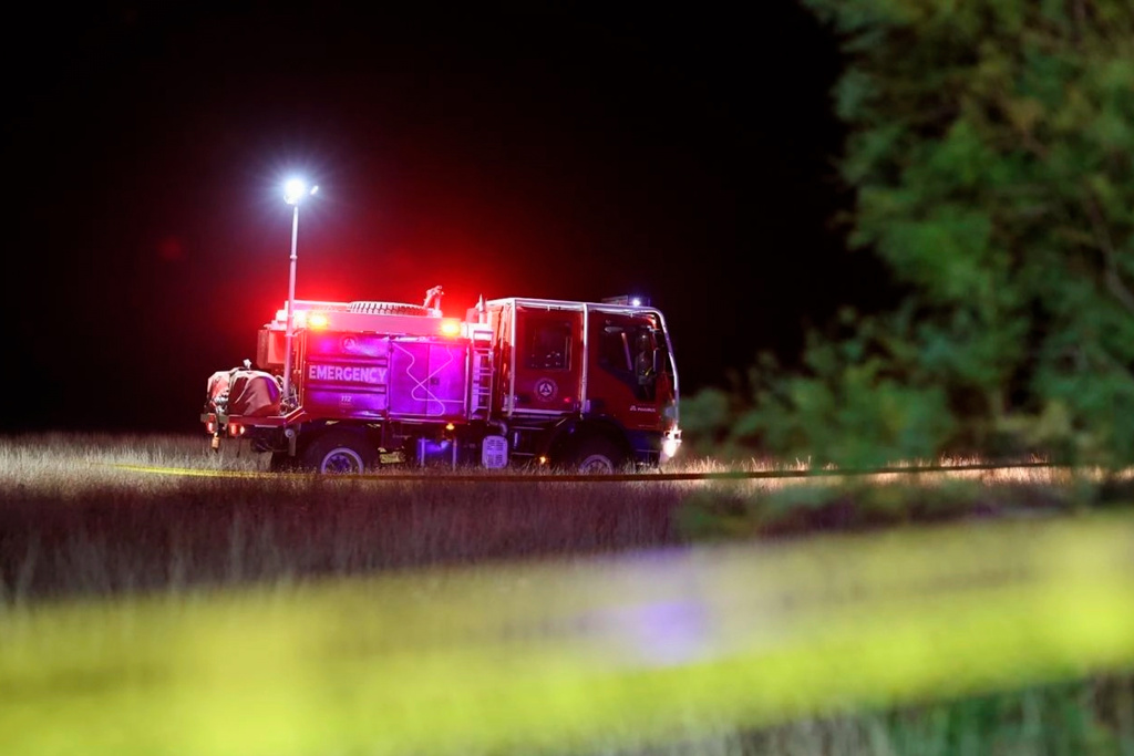 This photo released by Georgian Interior Ministry Press Service shows an emergency vehicle on a crash site of Turkish C-130 military cargo near the border between Georgia and Azerbaijan on Tuesday, Nov. 11, 2025. (Georgian Interior Ministry Press Service via AP)
