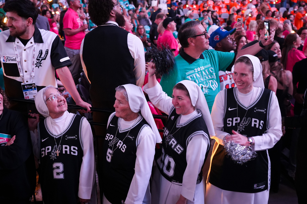The Salesian Sisters greet players prior to Game 1 of the NBA Finals basketball series between the New York Knicks and the San Antonio Spurs, Wednesday, June 3, 2026, in San Antonio. (AP Photo/Eric Gay)