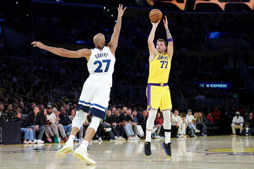 Los Angeles Lakers guard Luka Doncic (77) shoots against the Minnesota Timberwolves center Rudy Gobert (27) during the first half of an NBA basketball game, Friday, Oct. 24, 2025, in Los Angeles. (AP Photo/Jessie Alcheh) Los Angeles Lakers guard Luka Doncic (77) shoots against the Minnesota Timberwolves center Rudy Gobert (27) during the first half of an NBA basketball game, Friday, Oct. 24, 2025, in Los Angeles. (AP Photo/Jessie Alcheh)