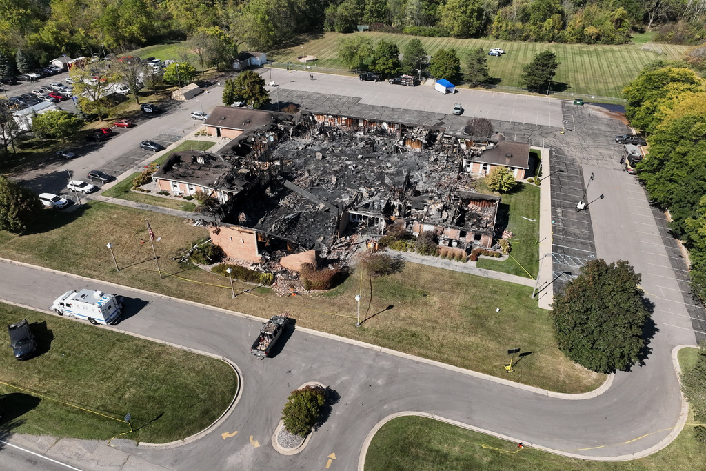 Little remained of The Church of Jesus Christ of Latter-day Saints chapel the day after a former Marine opened fire and set the building ablaze in Grand Blanc Township, Mich., Monday, Sept. 29, 2025. (AP Photo/Mark Vancleave)