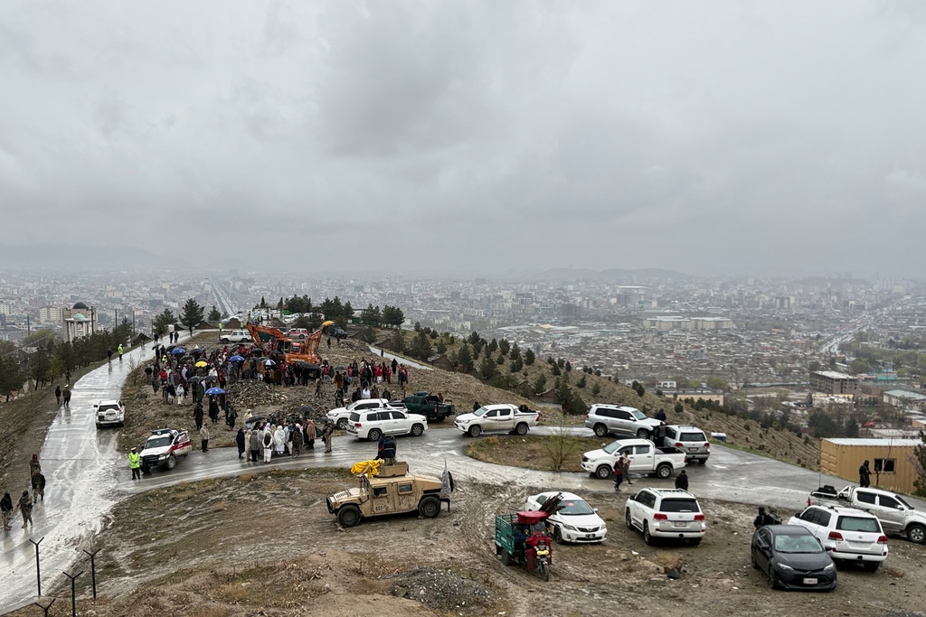 Bulldozers dig graves for victims of a Monday airstrike on a drug rehabilitation hospital in Kabul, Afghanistan, Wednesday, March 18, 2026. (AP Photo/Siddiqullah Alizai)