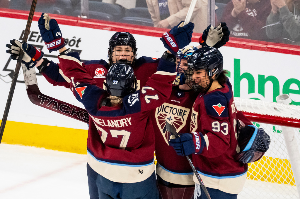 Montreal Victoire goaltender Ann-Renee Desbiens (35) celebrates with teammates after defeating the Seattle Torrent in a PWHL hockey game in Laval, Quebec, on Tuesday, April 7, 2026. (Christopher Katsarov/The Canadian Press via AP)