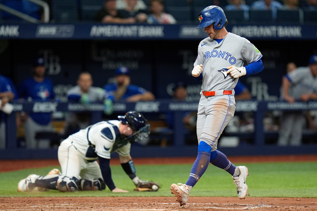 Toronto Blue Jays' Ernie Clement scores on an RBI single by Brett Bateman off Tampa Bay Rays pitcher Steven Matz during the fifth inning of a baseball game Tuesday, Aug. 18, 2026, in St. Petersburg, Fla. (AP Photo/Chris O'Meara)