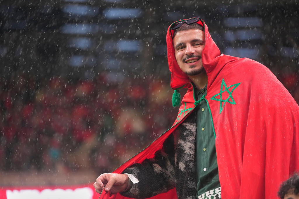 A Morocco fan waits for the Africa Cup of Nations group A soccer match between Morocco and Comoros in Rabat, Morocco, Sunday, Dec. 21, 2025. (AP Photo/Mosa'ab Elshamy)