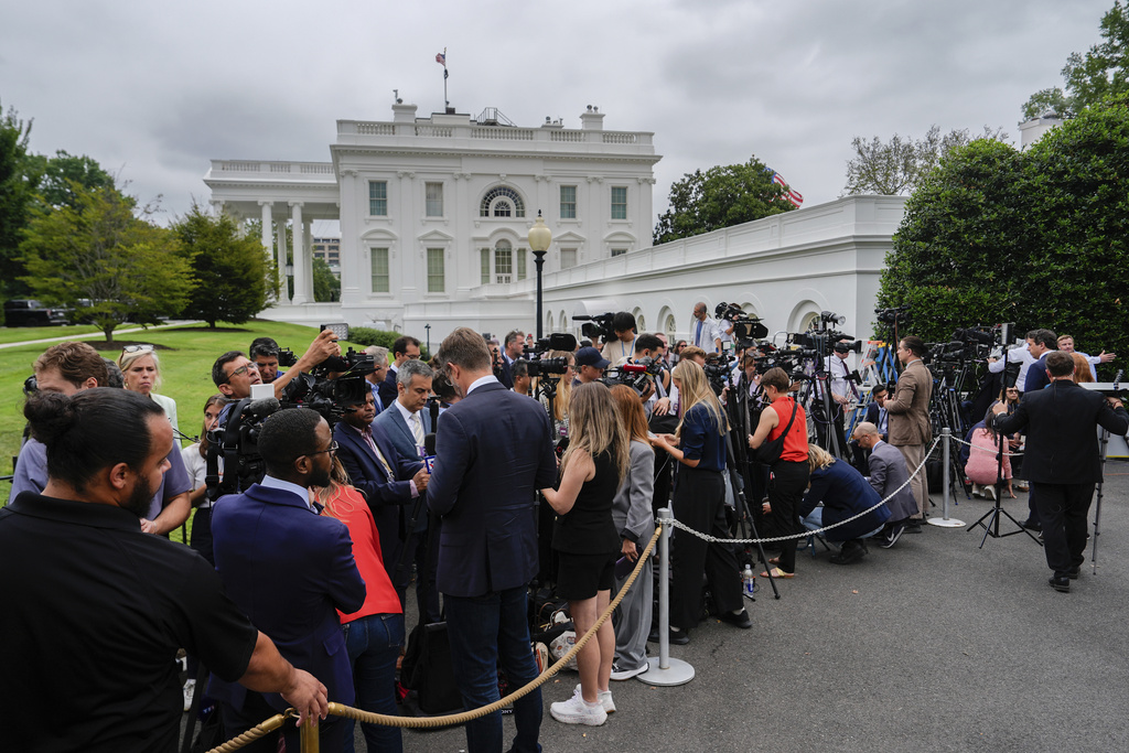Members of the media wait for the arrival of Ukraine's President Volodymyr Zelenskyy at the White House, Monday, Aug. 18, 2025, in Washington. (AP Photo/Julia Demaree Nikhinson)
