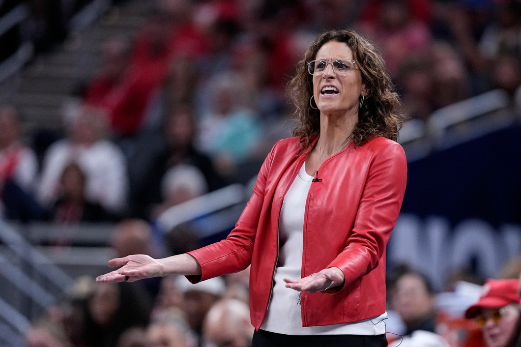 Indiana Fever head coach Stephanie White questions a call in the second half of a WNBA basketball game against the New York Liberty in Indianapolis, Tuesday, Aug. 11, 2026. (AP Photo/Michael Conroy)