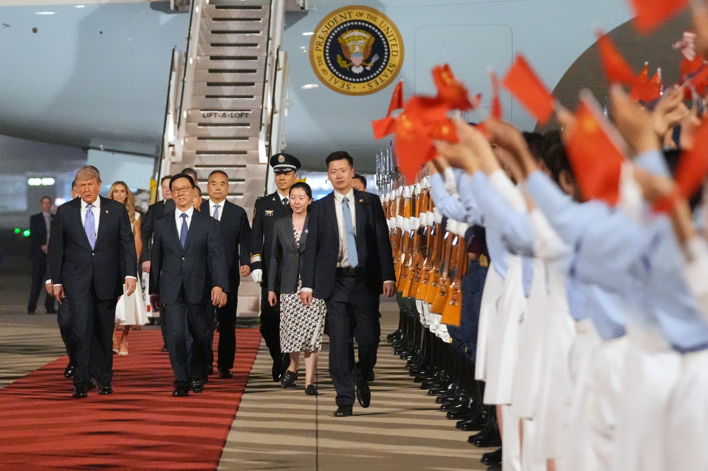 President Donald Trump walks with China's Vice President Han Zheng during a welcome ceremony Wednesday, May 13, 2026, at Beijing Capital International Airport in Beijing. (AP Photo/Mark Schiefelbein)