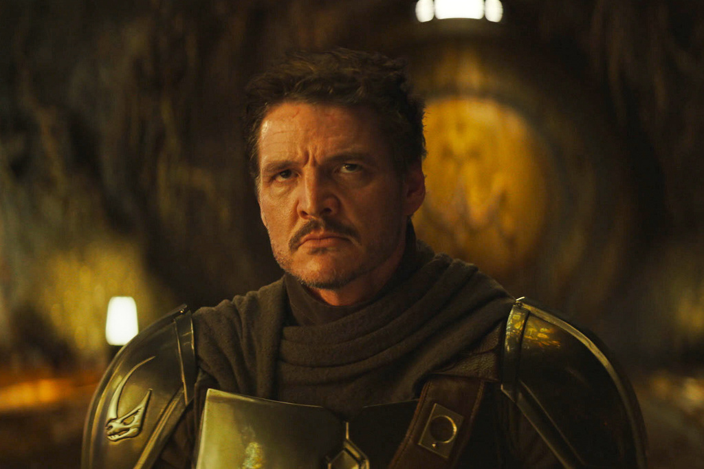 This image released by Disney shows The Mandalorian, portrayed by Pedro Pascal in a scene from Lucasfilm's "Star Wars: The Mandalorian and Grogu." (Lucasfilm Ltd. - Disney via AP)