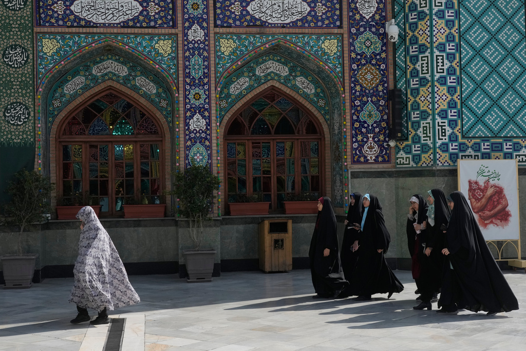Women walk at the shrine of Saint Saleh during the Muslim holy fasting month of Ramadan in northern Tehran, Iran, Thursday, Feb. 19, 2026. (AP Photo/Vahid Salemi)