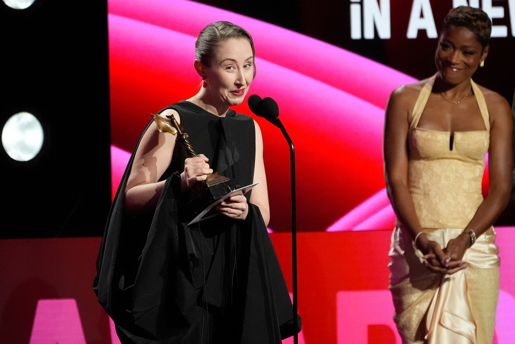 Erin Doherty accepts the award for best supporting performance in a new scripted series for "Adolescence" during the Film Independent Spirit Awards on Sunday, Feb. 15, 2026, at the Hollywood Palladium in Los Angeles. Kee Palmer looks on from right.(AP Photo/Chris Pizzello)