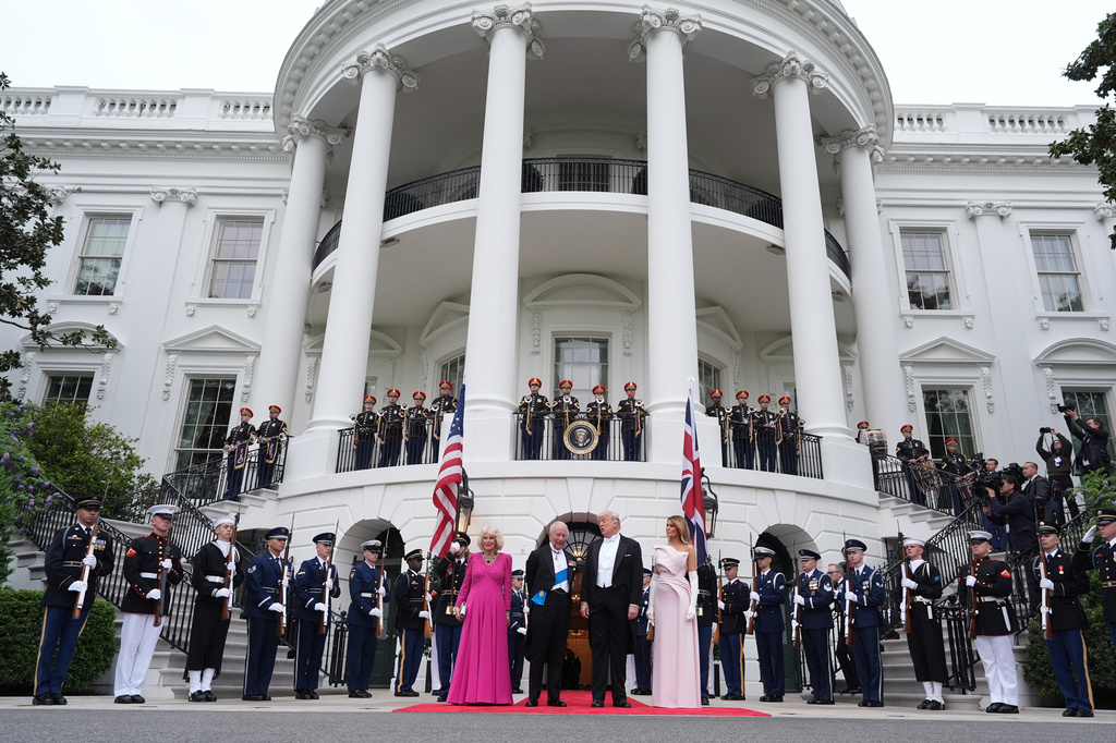 President Donald Trump and first lady Melania Trump greet Britain's King Charles III and Queen Camilla at the South Portico of the White House as they arrive for a State Dinner Tuesday, April 28, 2026, in Washington. (AP Photo/Alex Brandon)
