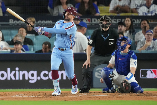 Philadelphia Phillies' Kyle Schwarber follows his solo home run off Los Angeles Dodgers starting pitcher Yoshinobu Yamamoto during the fourth inning in Game 3 of baseball's National League Division Series Wednesday, Oct. 8, 2025, in Los Angeles. (AP Photo/Jae C. Hong) Philadelphia Phillies' Kyle Schwarber follows his solo home run off Los Angeles Dodgers starting pitcher Yoshinobu Yamamoto during the fourth inning in Game 3 of baseball's National League Division Series Wednesday, Oct. 8, 2025, in Los Angeles. (AP Photo/Jae C. Hong)