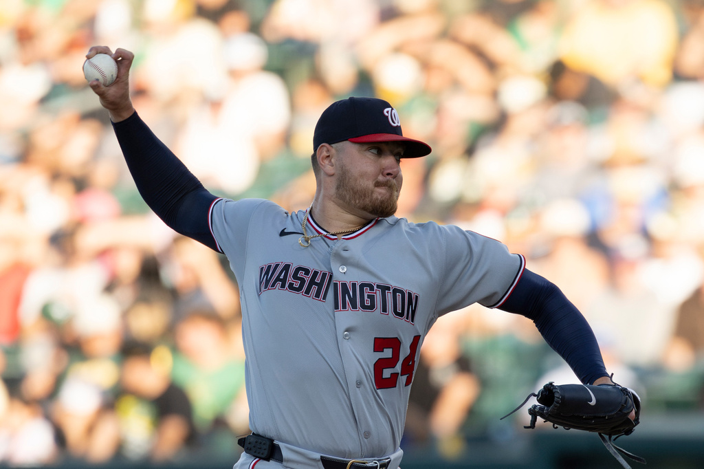 Washington Nationals pitcher Cade Cavalli throws to the Athletics during the second inning of a baseball game Friday, July 17, 2026, in West Sacramento, Calif. (AP Photo/Sara Nevis)