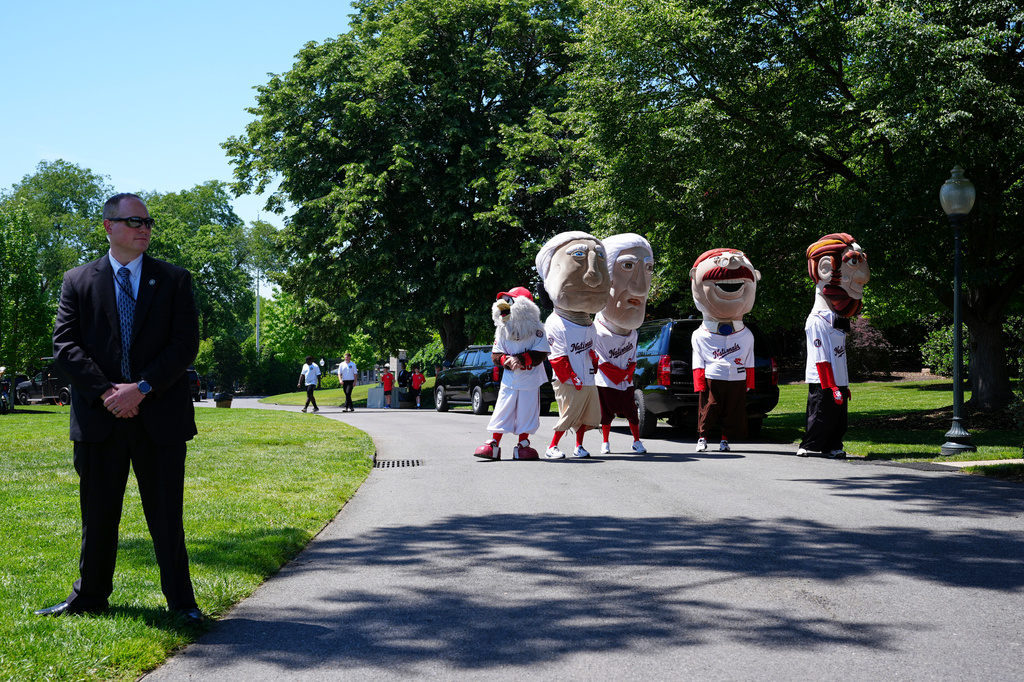 Mascots of the Washington Nationals baseball team stand near the south lawn of the White House, Tuesday, May 5, 2026, in Washington. (AP Photo/Jacquelyn Martin)
