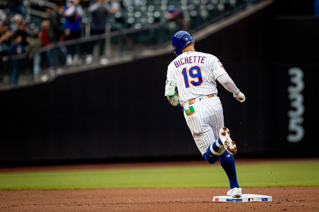 New York Mets' Bo Bichette (19) runs the bases during a home run in the first inning of a baseball game against the Washington Nationals, Tuesday, April 28, 2026, in New York. (AP Photo/Angelina Katsanis)