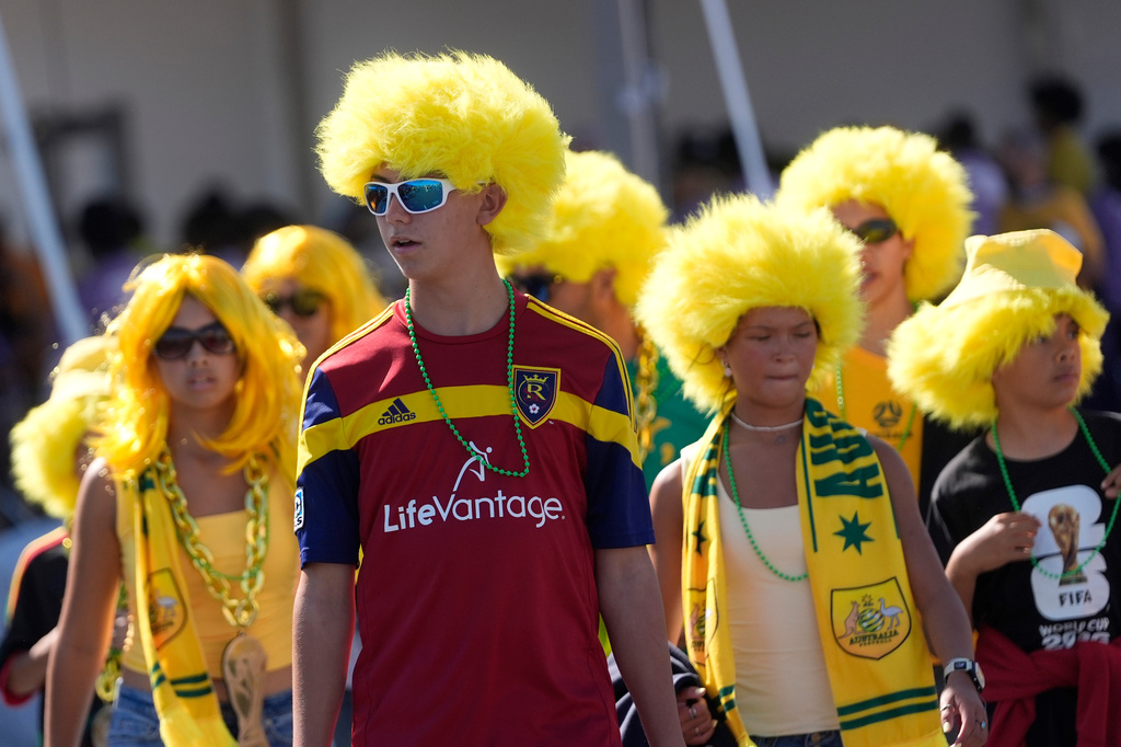 Australia fans don yellow wigs before the World Cup Group D soccer match between Paraguay and Australia in Santa Clara, Calif., near San Francisco, Thursday, June 25, 2026. (AP Photo/Jeff Chiu)