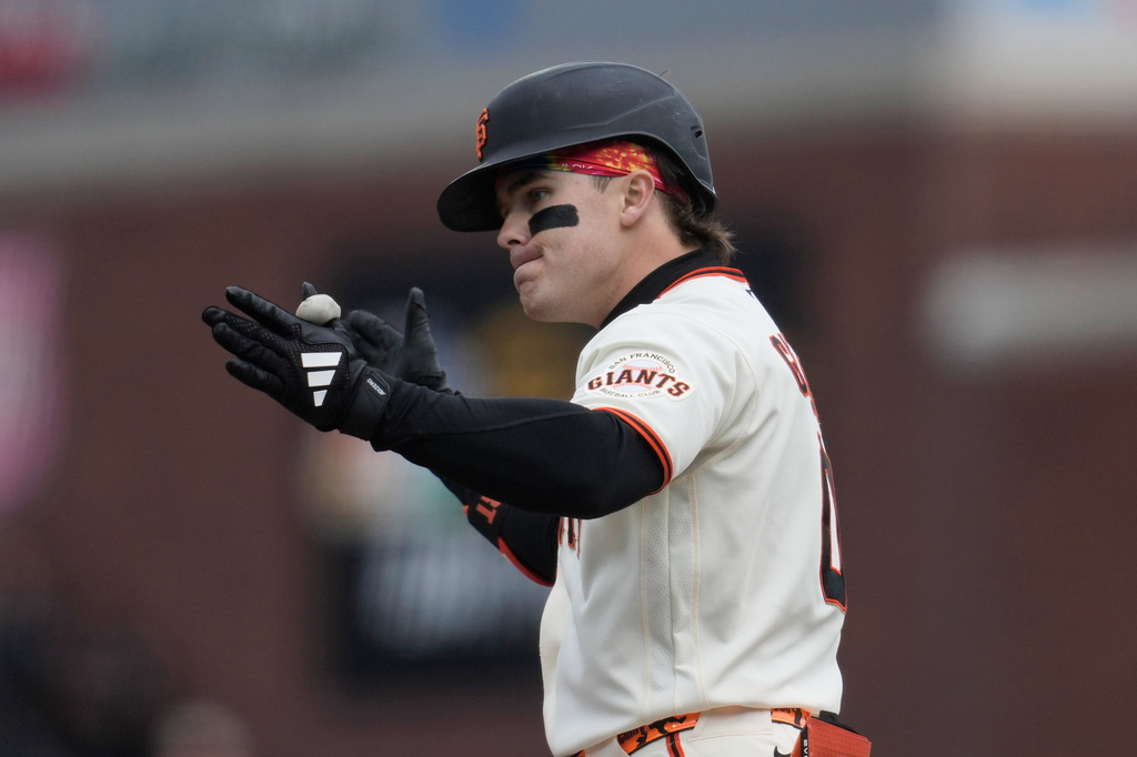 San Francisco Giants' Drew Gilbert gestures after hitting an RBI single during the sixth inning of a baseball game against the Miami Marlins Sunday, April 26, 2026, in San Francisco. (AP Photo/Jeff Chiu)