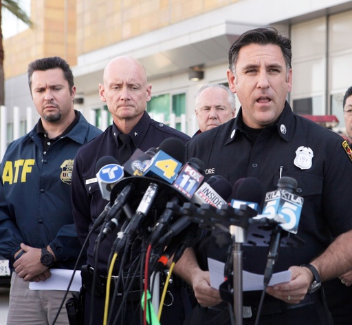 FILE - Los Angeles Fire Department Capt. Jaime Moore, right, addresses the media regarding the arrest of a man in connection with dozens of suspected arson attacks that destroyed parked cars, scorched buildings and rattled much of the nation's second-largest city over the New Year's weekend, Jan. 2, 2012, in Los Angeles. (AP Photo/Nick Ut, File) FILE - Los Angeles Fire Department Capt. Jaime Moore, right, addresses the media regarding the arrest of a man in connection with dozens of suspected arson attacks that destroyed parked cars, scorched buildings and rattled much of the nation's second-largest city over the New Year's weekend, Jan. 2, 2012, in Los Angeles. (AP Photo/Nick Ut, File)