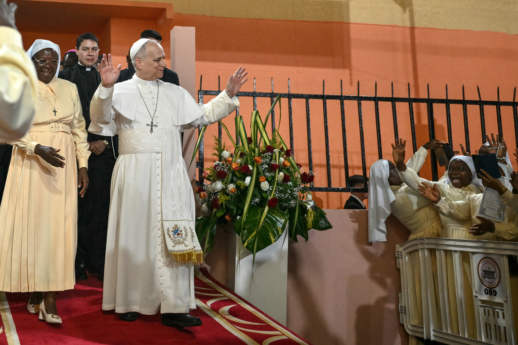 Pope Leo XIV waves to supporters as he leaves after his visit to the Ngul Zamba (Power of God) orphanage in Yaounde, Cameroon, Wednesday April 15, 2026 on the third day of his apostolic journey to Africa. (Alberto Pizzoli, Pool Photo via AP)
