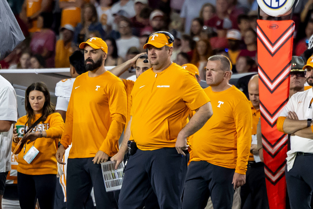 Tennessee head coach Josh Heupel, center, looks on during the second half of an NCAA college football game against Alabama, Saturday, Oct. 18, 2025, in Tuscaloosa, Ala. (AP Photo/Vasha Hunt)