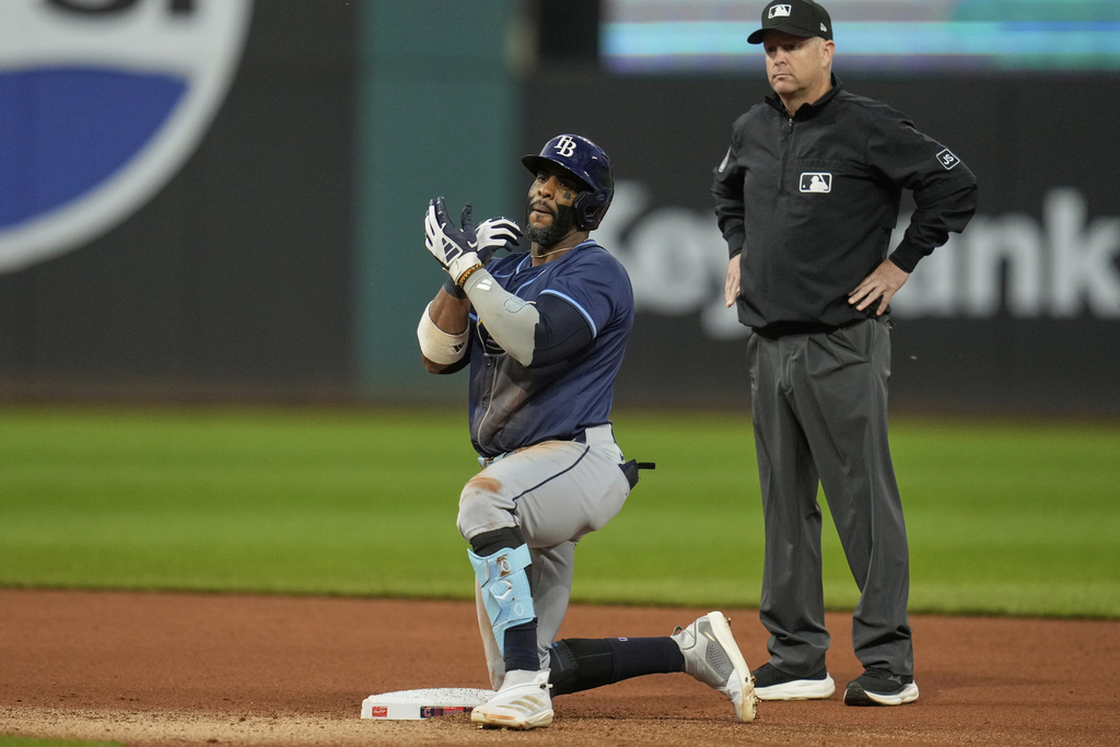 Tampa Bay Rays' Yandy Diaz gestures from second base after hitting a double in the seventh inning of a baseball game against the Cleveland Guardians in Cleveland, Tuesday, Aug. 26, 2025. (AP Photo/Sue Ogrocki)