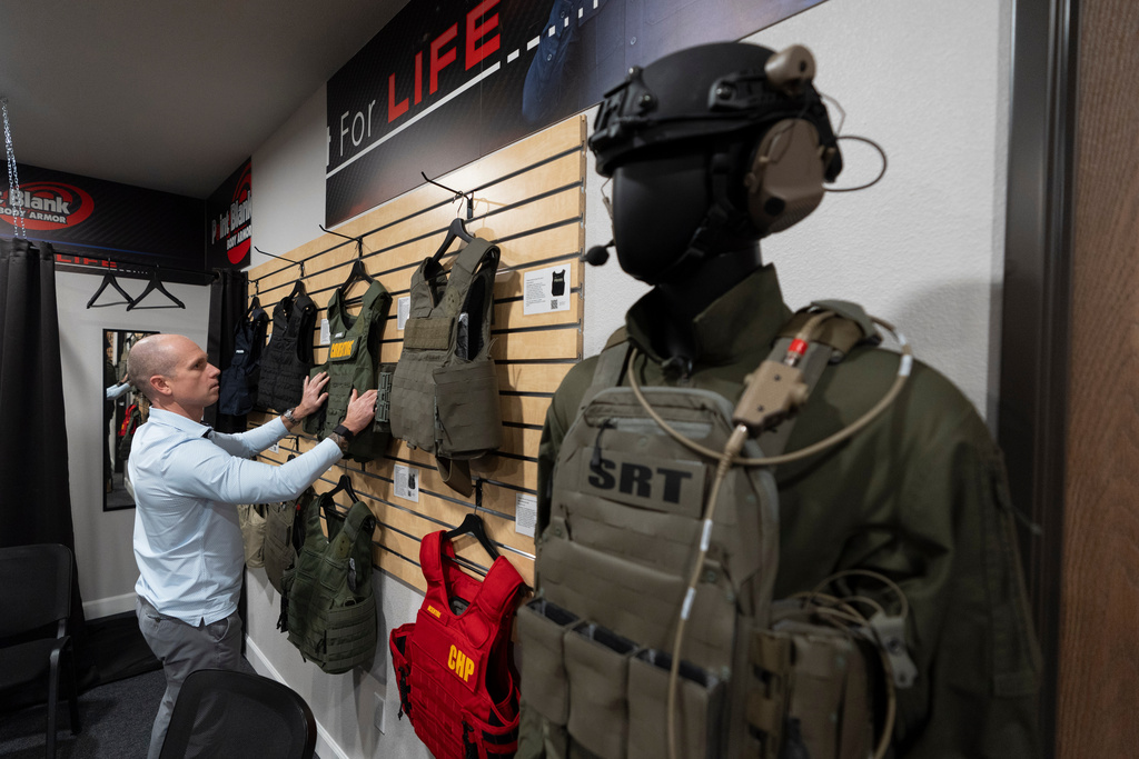 FILE - Veteran and business owner Jackson Dalton arranges protective gear at the Black Box Safety offices, Thursday, Nov. 7, 2024, in El Cajon, Calif. (AP Photo/Gregory Bull, File)