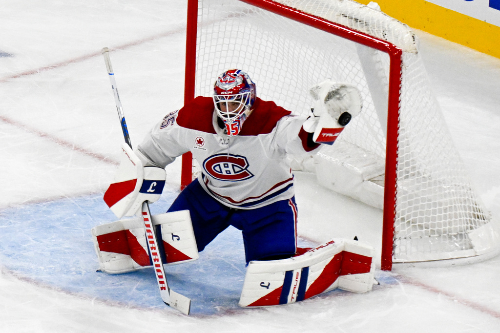 Montreal Canadiens goaltender Sam Montembeault makes a save against the Chicago Blackhawks during the second period of an NHL hockey game, Saturday, Oct. 11, 2025, in Chicago. (AP Photo/Matt Marton)
