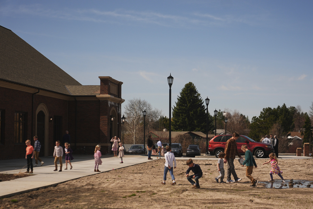 Children walk outside after Sunday morning services at the new campus for Christ Church and its Logos School, Sunday, April 6, 2025, in Moscow, Idaho. (AP Photo/Lindsey Wasson)