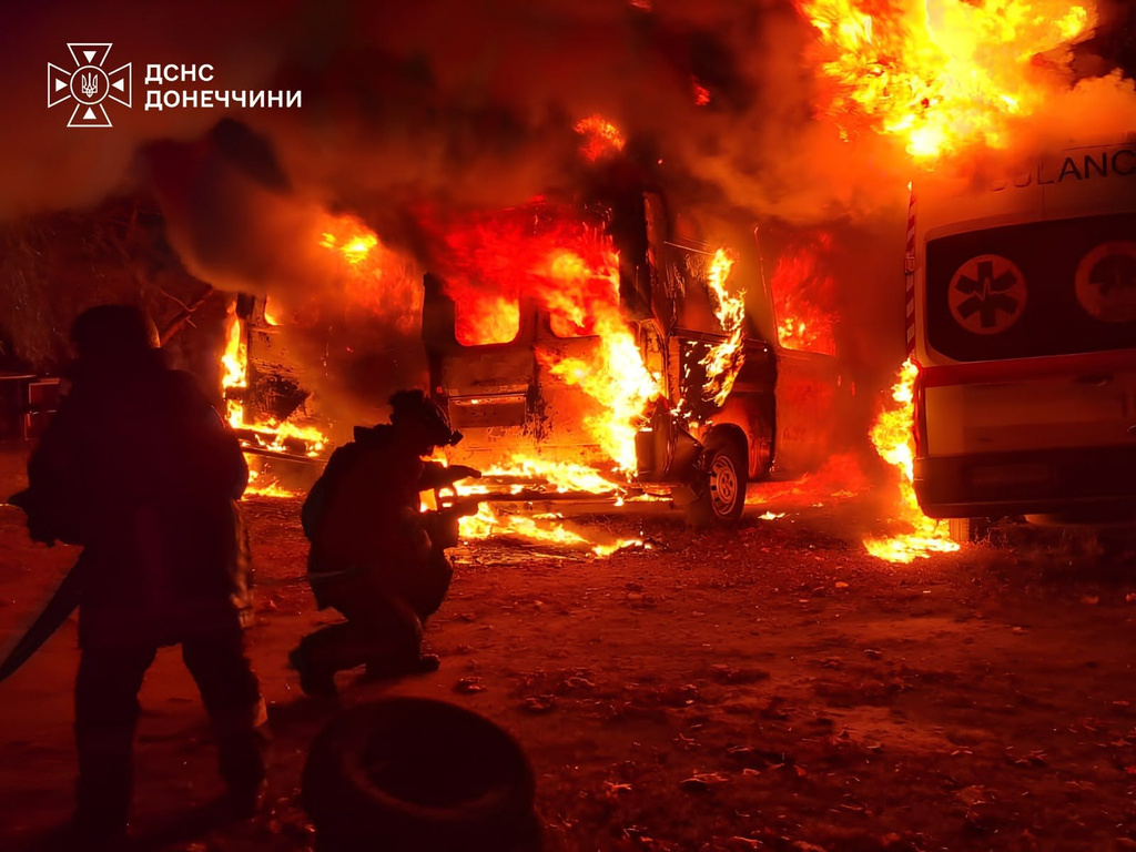 In this photo provided by the Ukrainian Emergency Services on Tuesday, Oct. 6, 2026, rescue workers put out a fire of ambulances after a Russian strike on a medical facility of Kramatorsk, Ukraine. (Ukrainian Emergency Service via AP)