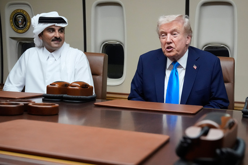 President Donald Trump, right, meets with Emir of Qatar Sheikh Tamim bin Hamad al-Thani aboard Air Force One at Al Udeid Air Base in Doha, Qatar, Saturday, Oct. 25, 2025. (AP Photo/Mark Schiefelbein) President Donald Trump, right, meets with Emir of Qatar Sheikh Tamim bin Hamad al-Thani aboard Air Force One at Al Udeid Air Base in Doha, Qatar, Saturday, Oct. 25, 2025. (AP Photo/Mark Schiefelbein)