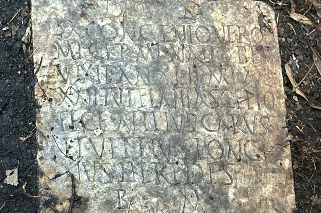This photo provided by Tulane University classical archeologist Susann Lusnia in October 2025 shows a Latin inscription on the 1,900-year-old grave marker of a Roman sailor named Sextus Congenius Verus, discovered in a New Orleans backyard. (Susann Lusnia via AP)