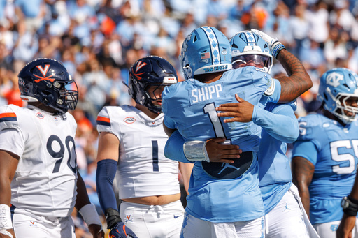 North Carolina's Jordan Shipp (1) celebrates with quarterback Gio Lopez, right, after a touchdown during the first half of an NCAA college football game against Virginia in Chapel Hill, N.C., Saturday, Oct. 25, 2025. (AP Photo/Ben McKeown) North Carolina's Jordan Shipp (1) celebrates with quarterback Gio Lopez, right, after a touchdown during the first half of an NCAA college football game against Virginia in Chapel Hill, N.C., Saturday, Oct. 25, 2025. (AP Photo/Ben McKeown)