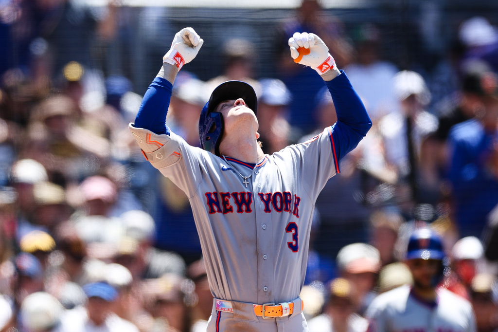 New York Mets' Carson Benge gestures towards the sky as he crosses home plate after hitting a solo home run against the San Diego Padres in the sixth inning of a baseball game Sunday, June 7, 2026, in San Diego. (AP Photo/Derrick Tuskan)