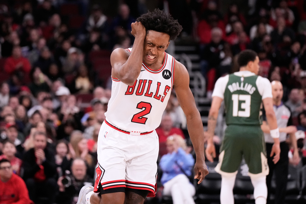 Chicago Bulls guard Collin Sexton reacts after scoring a 3-point basket during the first half of an NBA basketball game against the Milwaukee Bucks in Chicago, Sunday, March 1, 2026. (AP Photo/Nam Y. Huh)
