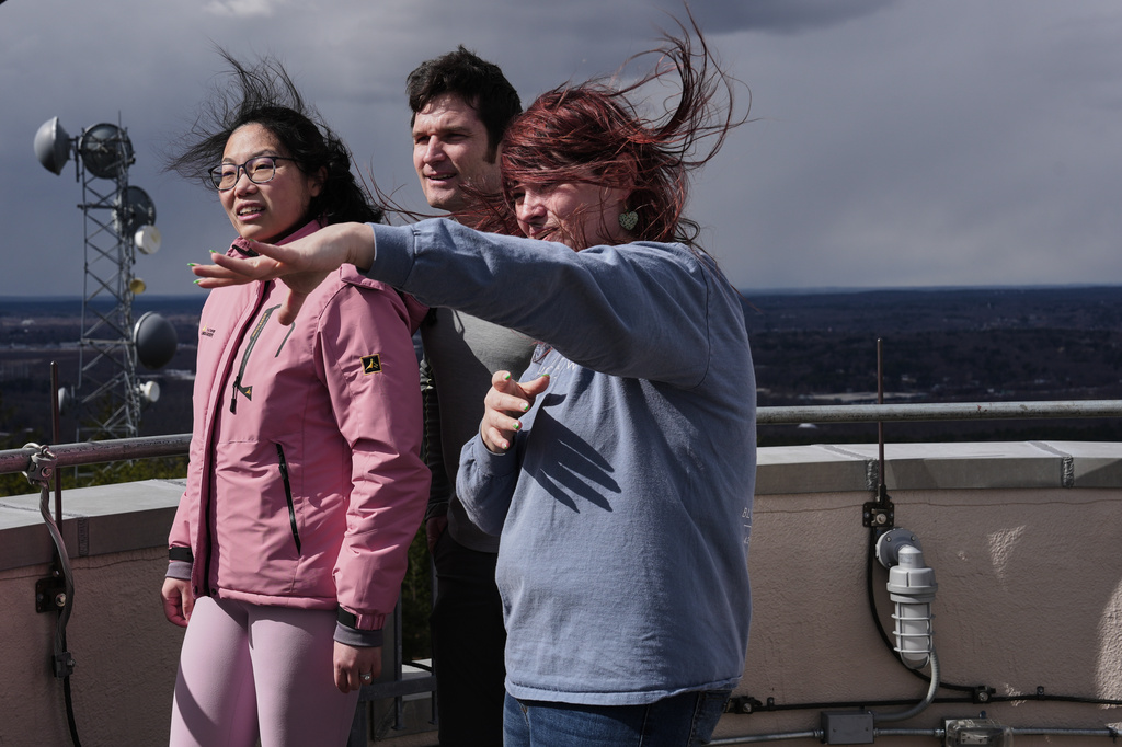 Amanda Joly, right, gives a tour to Naomi Jang, left, and Miles Abel, center, at the Blue Hill Observatory and Science Center, Saturday, March 14, 2026, in Milton, Mass. (Laura Martin Agudelo/MIT Graduate Program in Science Writing via AP)