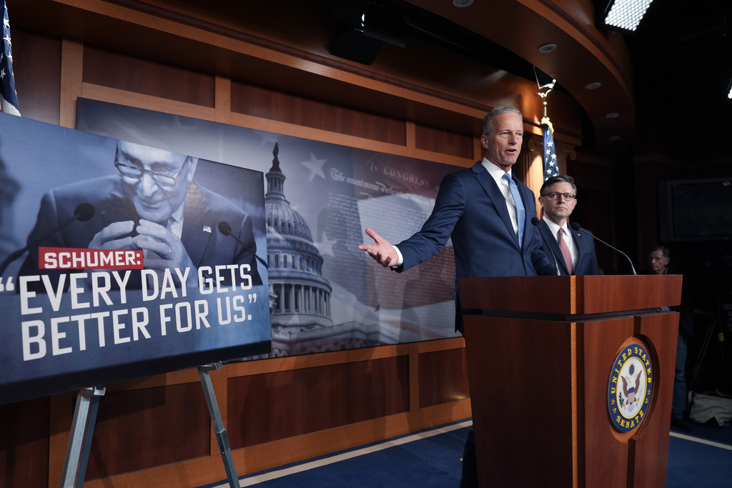 Senate Majority Leader John Thune, R-S.D., left, and Speaker of the House Mike Johnson, R-La., speak at a news conference as the government shutdown begins its tenth day, in Washington, Friday, Oct. 10, 2025. (AP Photo/J. Scott Applewhite)