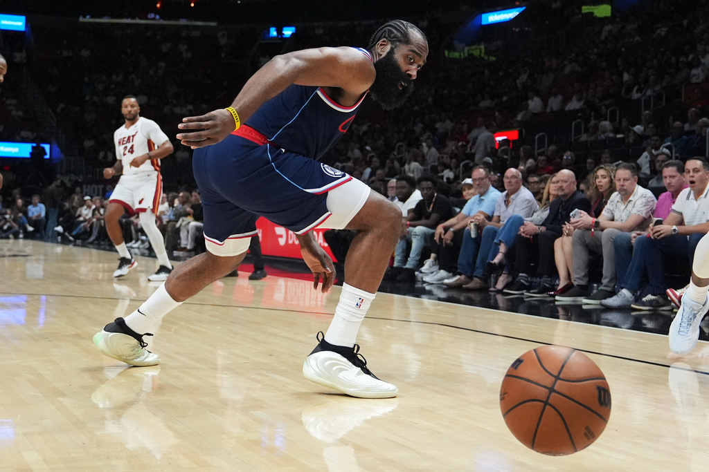 Los Angeles Clippers guard James Harden goes for a loose ball during the first half of an NBA basketball game against the Miami Heat, Monday, Dec. 1, 2025, in Miami. (AP Photo/Lynne Sladky)