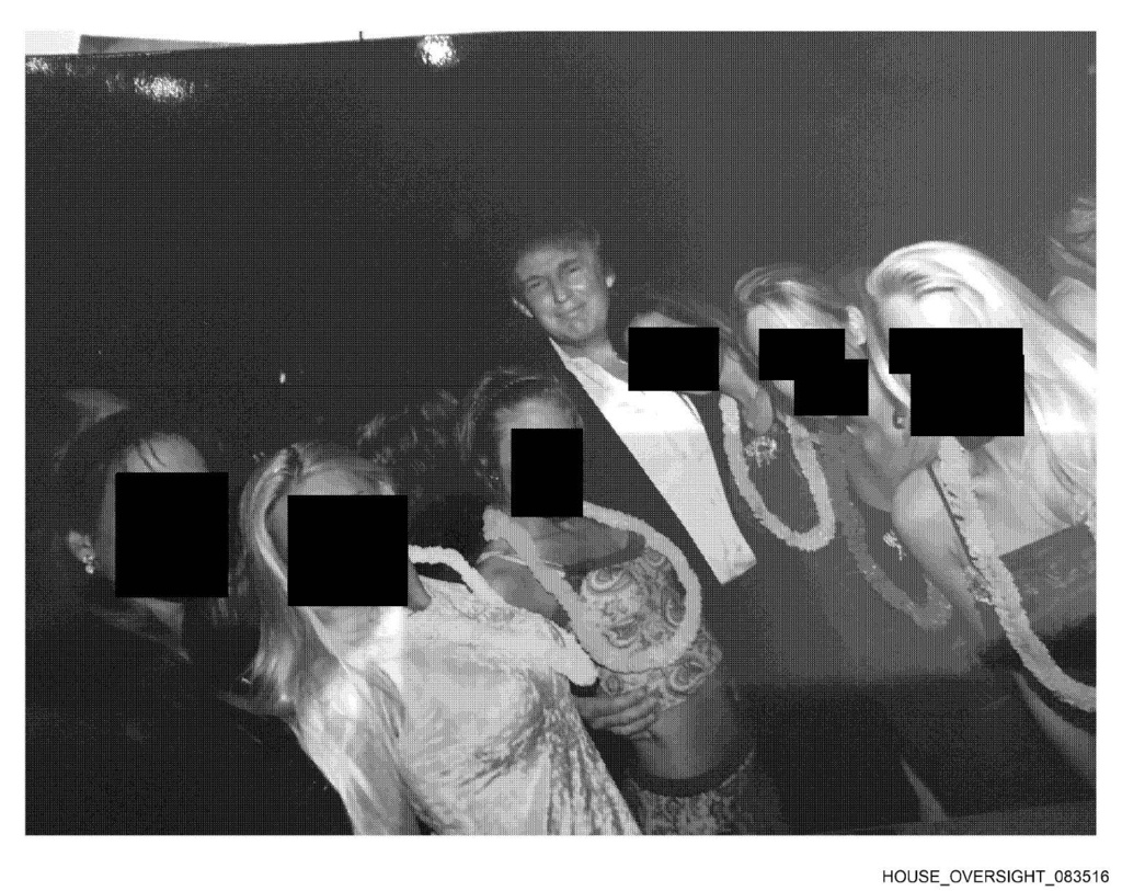 This undated, redacted photo released by Democrats on the House Oversight Committee shows Donald Trump standing with a group of women. (House Oversight Committee via AP)