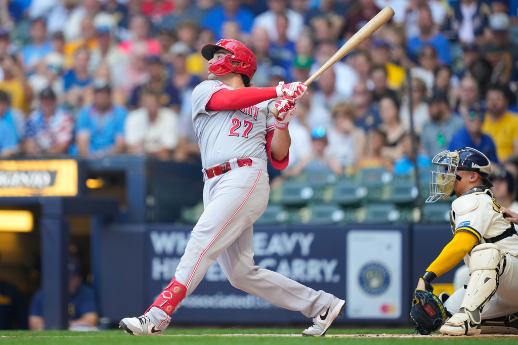 Cincinnati Reds' Sal Stewart hits a home run as Milwaukee Brewers catcher William Contreras, right, looks on during the first inning of a baseball game Thursday, July 2, 2026, in Milwaukee. (AP Photo/Kayla Wolf)