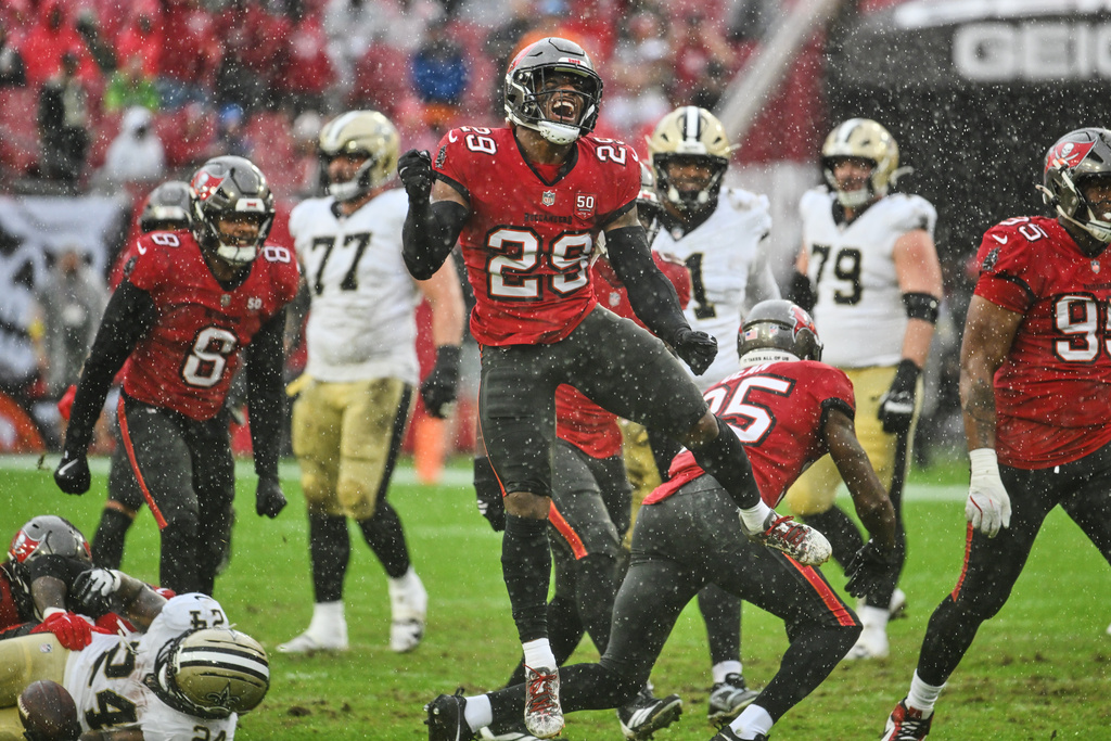 Tampa Bay Buccaneers safety Christian Izien (29) celebrates after stopping the New Orleans Saints on fourth down in the first half of an NFL football game, Sunday, Dec. 7, 2025, in Tampa, Fla. (AP Photo/Jason Behnken)