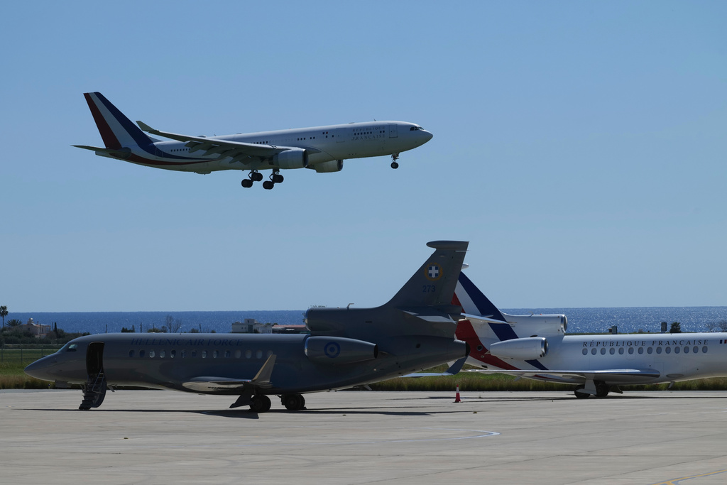The aircraft transporting French President Emmanuel Macron lands ahead of his meeting with Greece's Prime Minister Kyriakos Mitsotakis and Cyprus President Nikos Christodoulides at Andreas Papandreou Air Base in Paphos, Cyprus, on Monday, March 9, 2026. (AP Photo/Petros Karadjias)