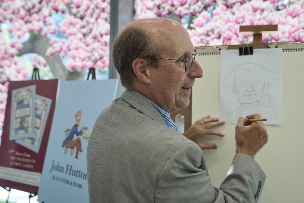 John Hutton, illustrator and professor of art history at Salem College, draws a picture of President George Washington, Tuesday, Aug. 12, 2025, from his book, "How To Draw The Presidents and First Ladies," at The People's House, a museum in Washington. (AP Photo/Jacquelyn Martin)