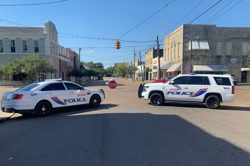 Police vehicles are parked after a deadly shooting Friday night in downtown Leland, Miss.,on Saturday, Oct. 11, 2025. (AP Photo/Katie Adkins) Police vehicles are parked after a deadly shooting Friday night in downtown Leland, Miss.,on Saturday, Oct. 11, 2025. (AP Photo/Katie Adkins)