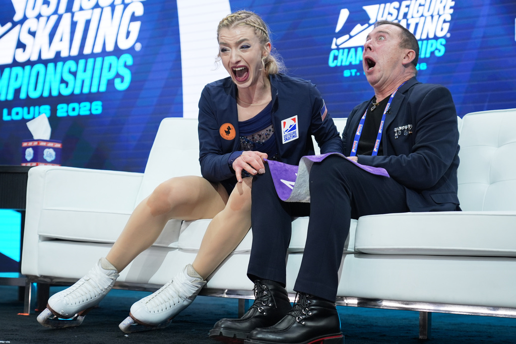 Amber Glenn reacts to seeing her scores after competing during the women's free skating competition at the U.S. Figure Skating Championships, Friday, Jan. 9, 2026, in St. Louis. (AP Photo/Stephanie Scarbrough)