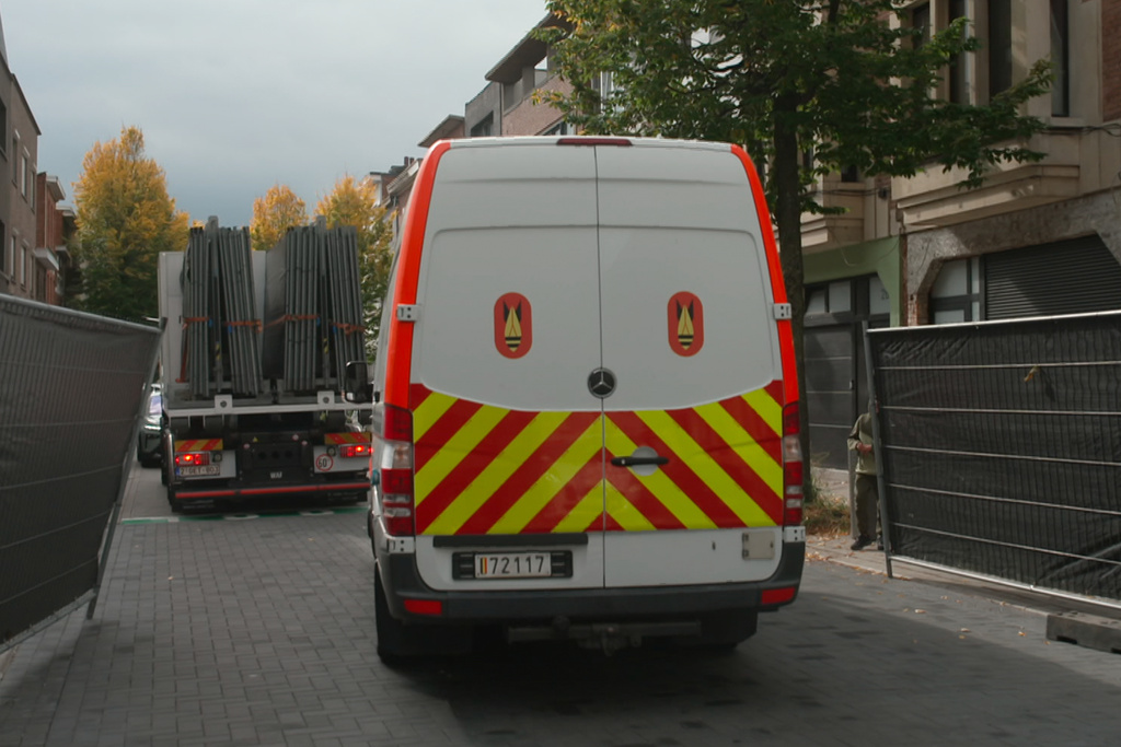 In this image taken from video provided by VTM, a bomb disposal truck is parked near a police cordon during an investigation in Antwerp, Belgium, Thursday, Oct. 9, 2025. (VTM via AP)