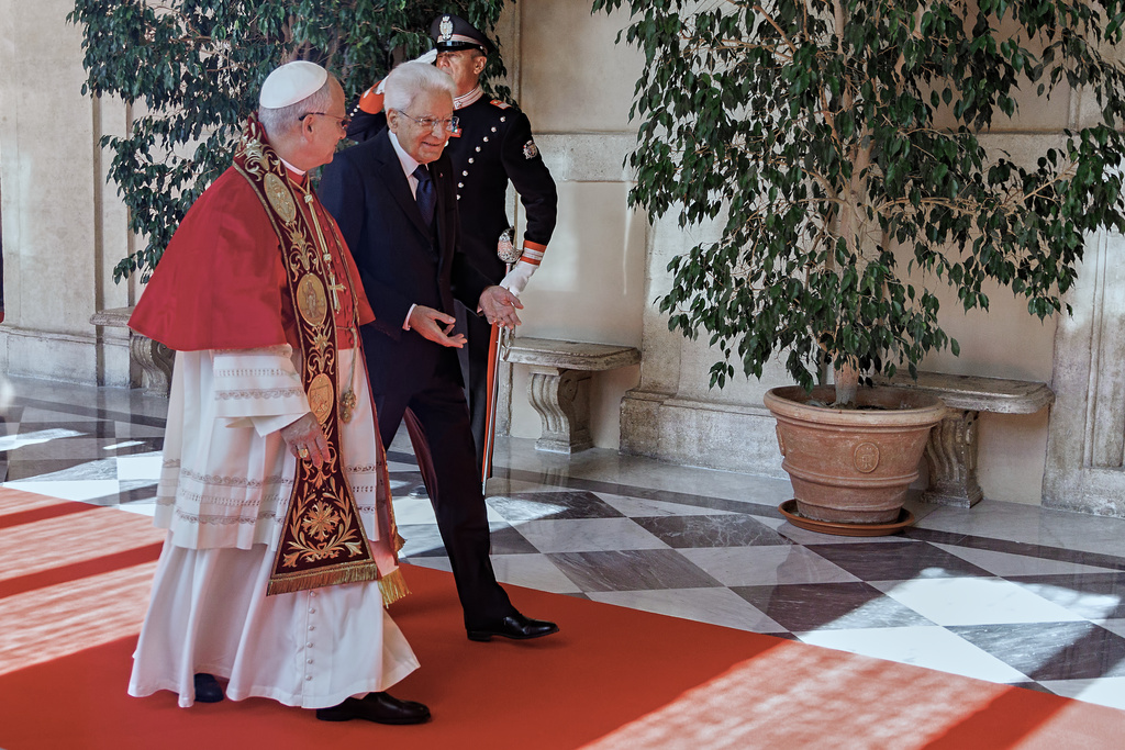 Italian President Sergio Mattarella, right, welcomes Pope Leo XIV as he arrives at the Quirinale Presidential Palace in Rome, Tuesday, Oct. 14, 2025. (Roberto Monaldo/LaPresse via AP)