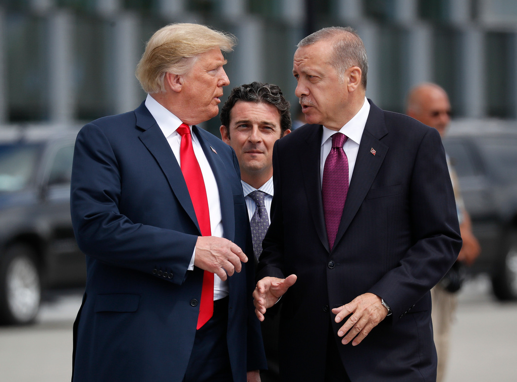 FILE - President Donald Trump, left, talks with Turkey's President Recep Tayyip Erdogan at a summit of heads of state and government at NATO headquarters in Brussels, July 11, 2018. (AP Photo/Pablo Martinez Monsivais, File)