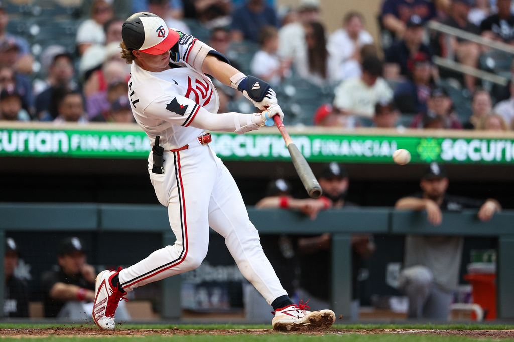 Minnesota Twins' Luke Keaschall hits an RBI double against the Chicago White Sox during the fourth inning of a baseball game, Tuesday, June 2, 2026, in Minneapolis. (AP Photo/Matt Krohn)