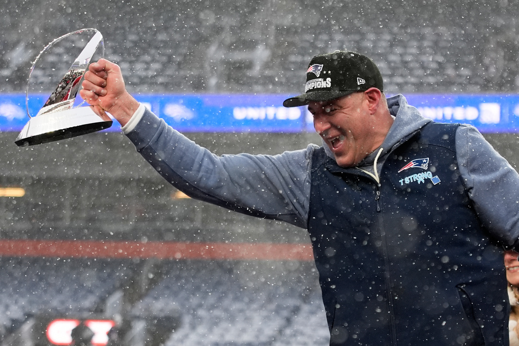 New England Patriots head coach Mike Vrabel celebrates with the trophy after the AFC Championship NFL football game between the Denver Broncos and the New England Patriots, Sunday, Jan. 25, 2026, in Denver. (AP Photo/John Locher)
